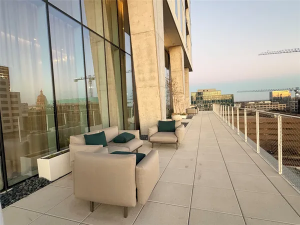 a view of a balcony with a floor to ceiling window