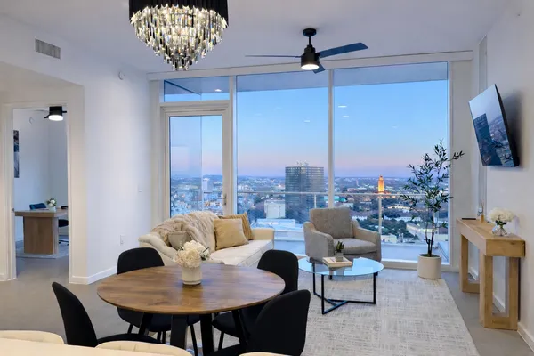 a living room with furniture and a large window