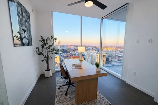 a workspace with furniture and window