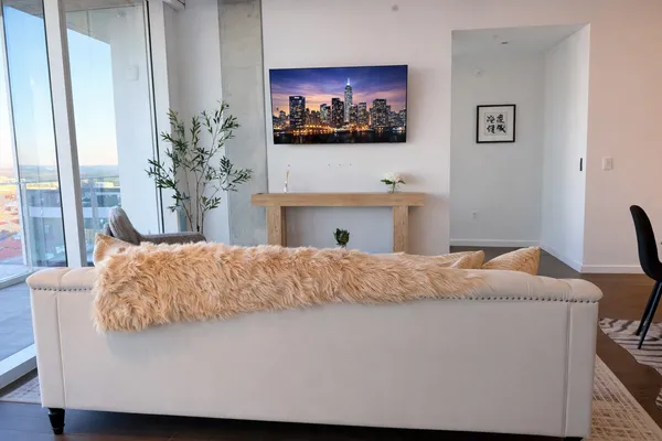 a living room with a couch and a flat screen tv