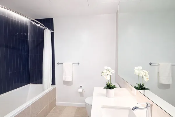 a bath room with a sink and a bath tub