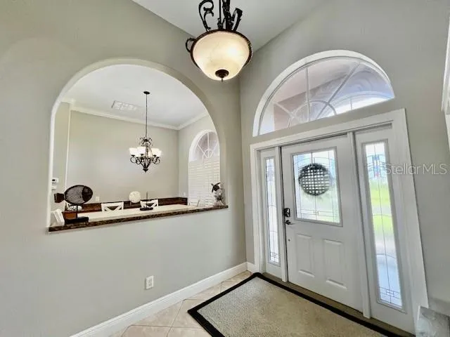 a bathroom with a granite countertop sink a mirror and shower