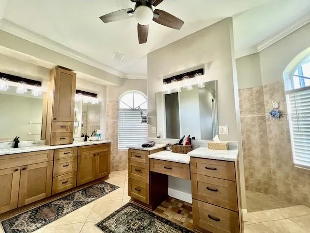 a bathroom with a bathtub and a window