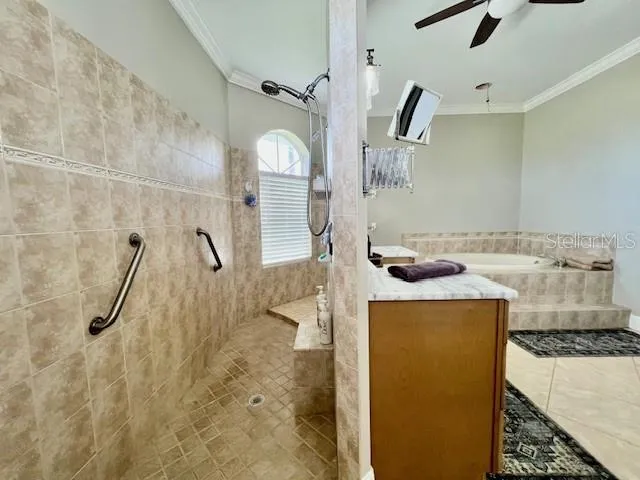 a bathroom with a tub sink and mirror