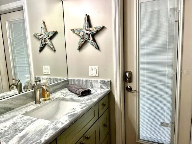 a front view of house with yard and outdoor seating