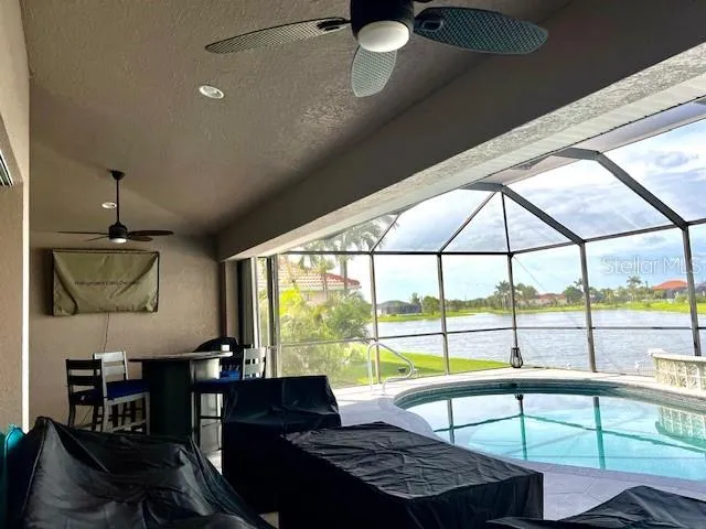 a view of a swimming pool with a patio