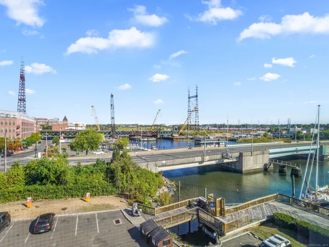 a view of a lake with tall buildings
