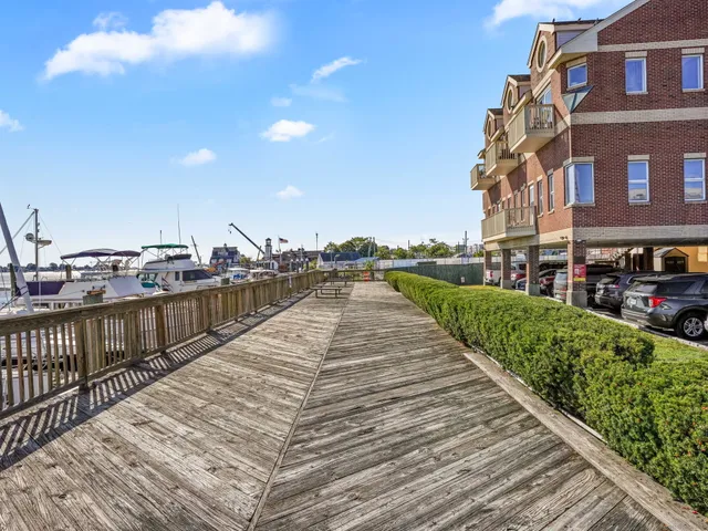 a view of a brick building next to a yard