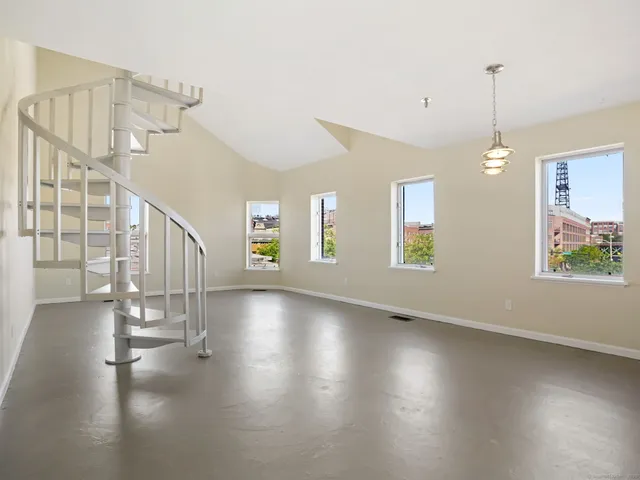 a view of an entryway with wooden floor