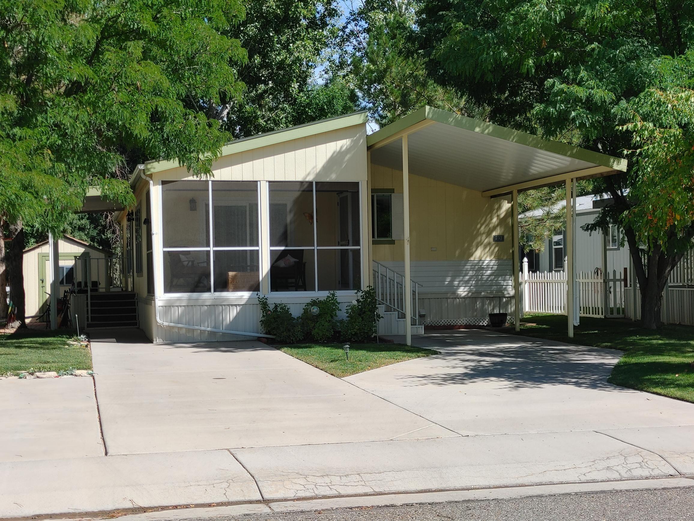 435 32 Road, Unit 252 Clifton, CO 81520 - Photo 2 of 27 a front view of a house with garden