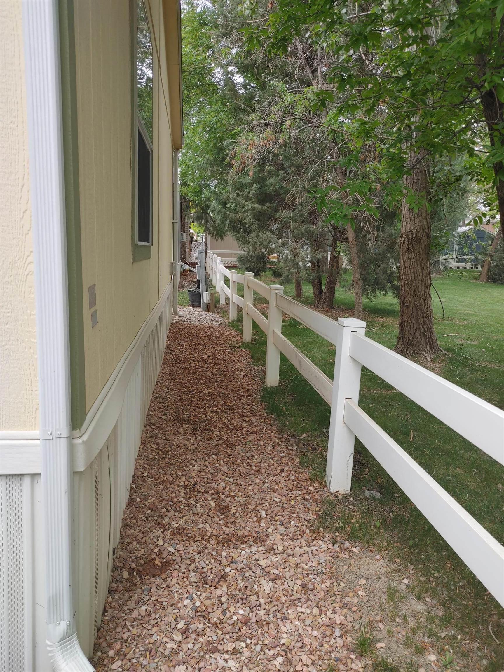 435 32 Road, Unit 252 Clifton, CO 81520 - Photo 24 of 27 a view of a yard with wooden fence