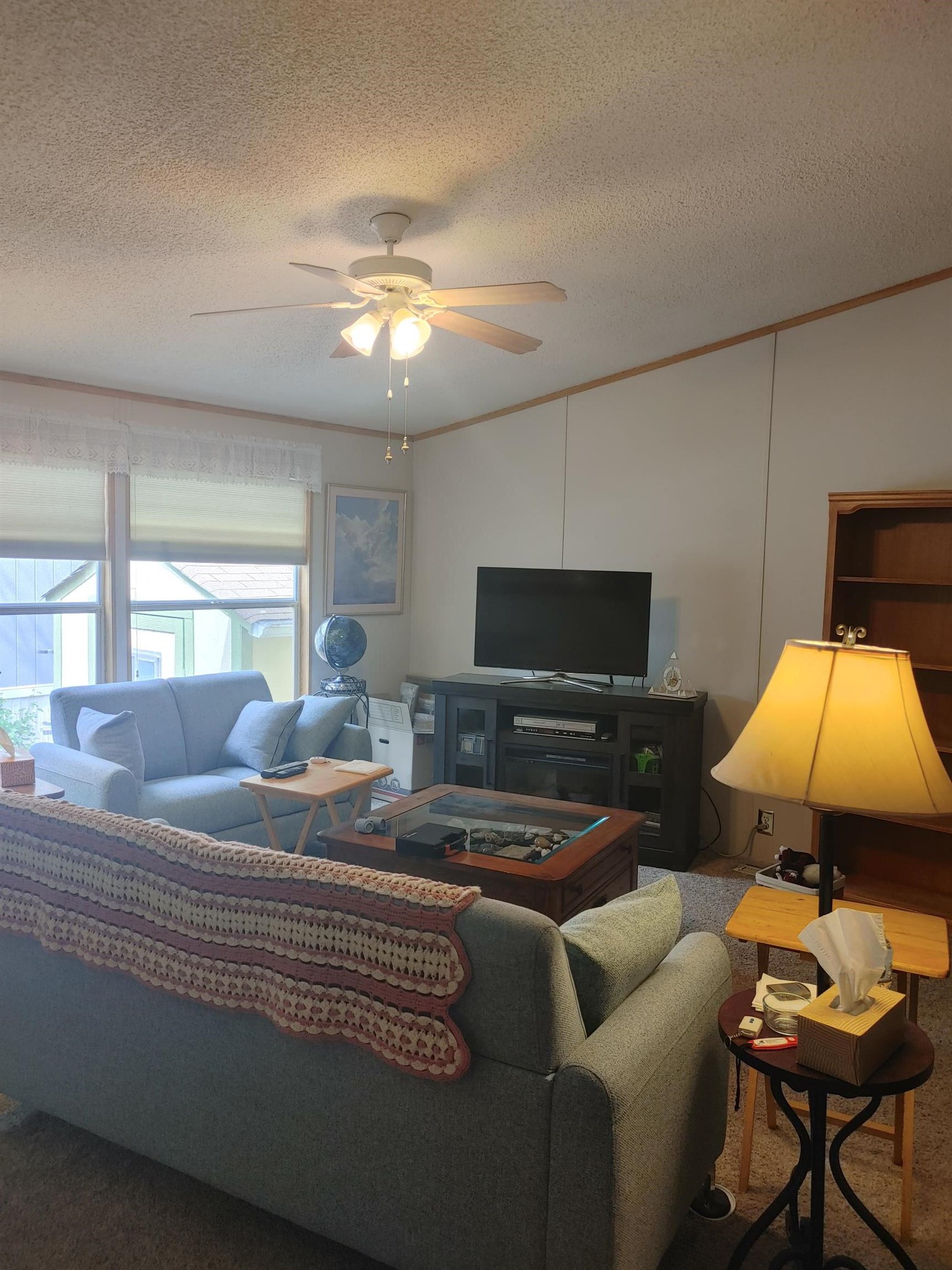 435 32 Road, Unit 252 Clifton, CO 81520 - Photo 9 of 27 a living room with furniture and a flat screen tv