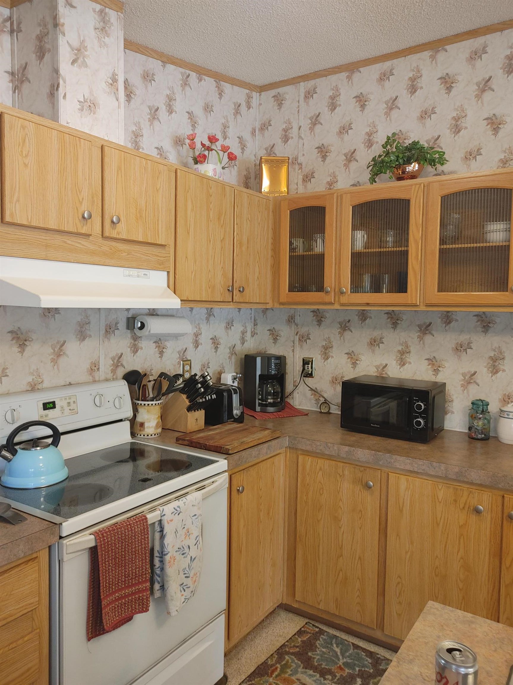 435 32 Road, Unit 252 Clifton, CO 81520 - Photo 10 of 27 a kitchen with stainless steel appliances a stove a sink and a microwave
