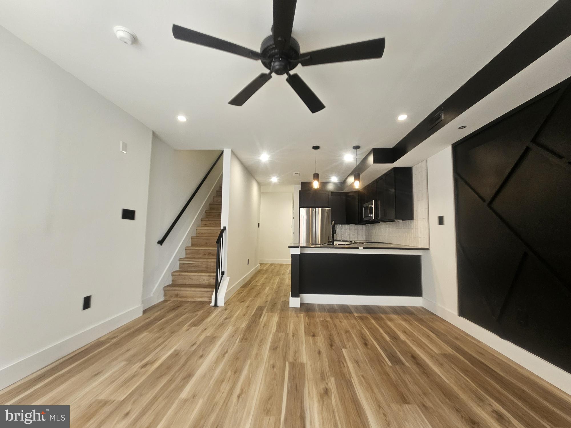 a view of entryway and kitchen