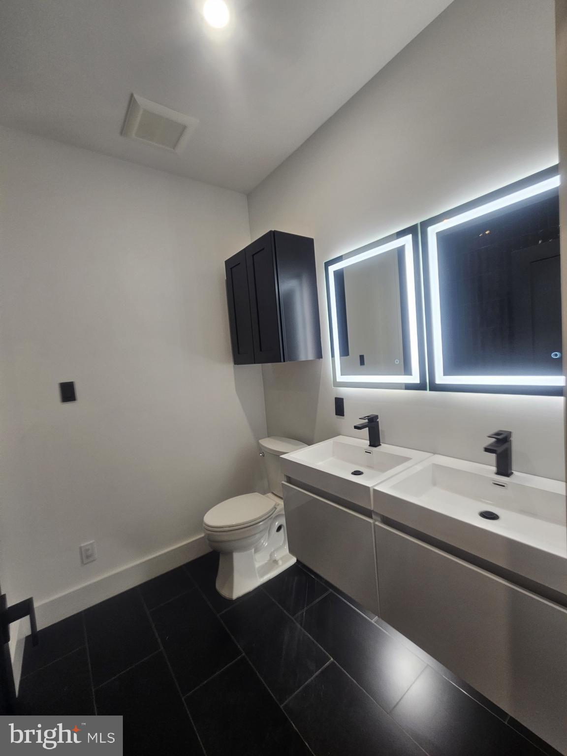 1250 North 18th Street, Unit 1 Philadelphia, PA 19121 - Photo 13 of 26 a bathroom with a sink and a mirror