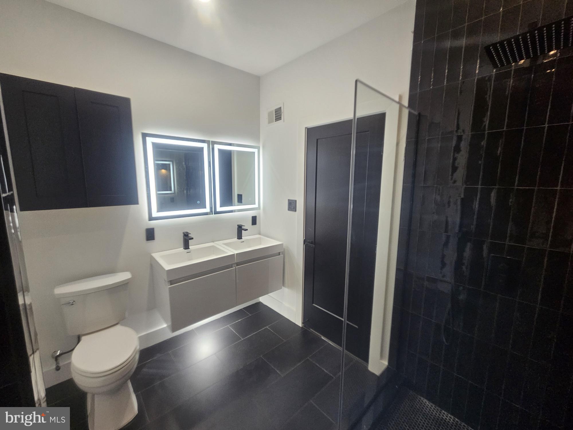 1250 North 18th Street, Unit 1 Philadelphia, PA 19121 - Photo 15 of 26 a bathroom with a toilet a sink and bathtub