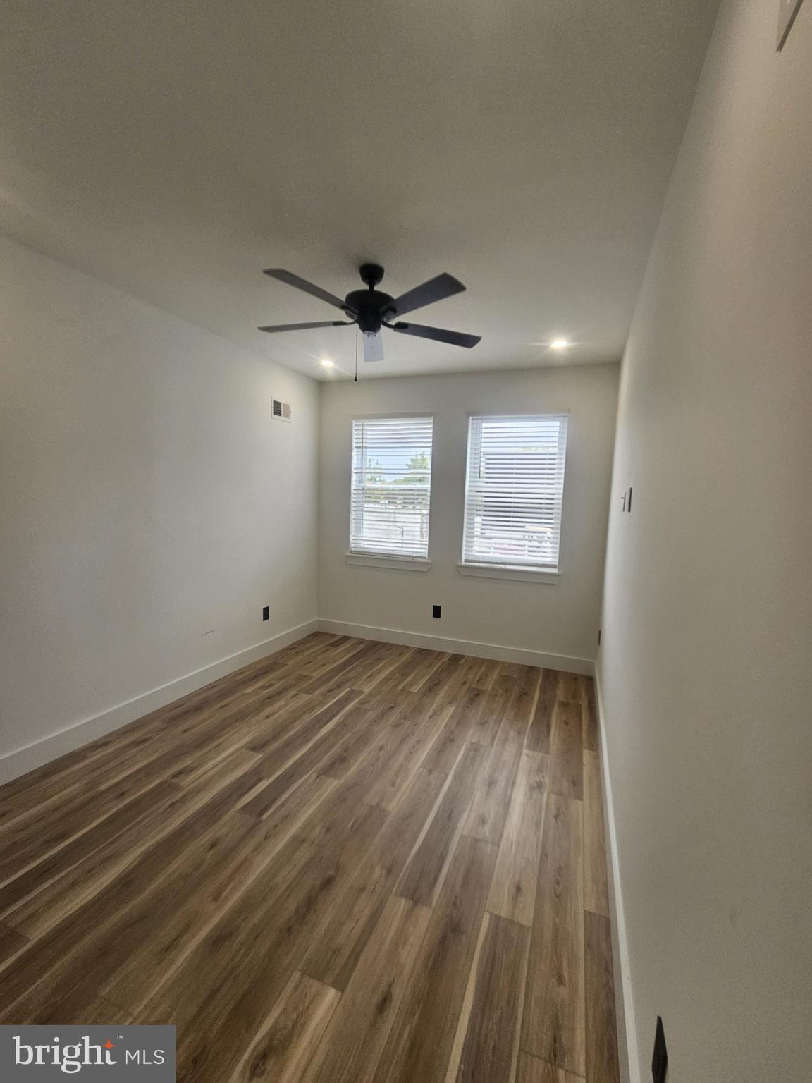 1250 North 18th Street, Unit 1 Philadelphia, PA 19121 - Photo 23 of 26 a view of a livingroom with wooden floor and window