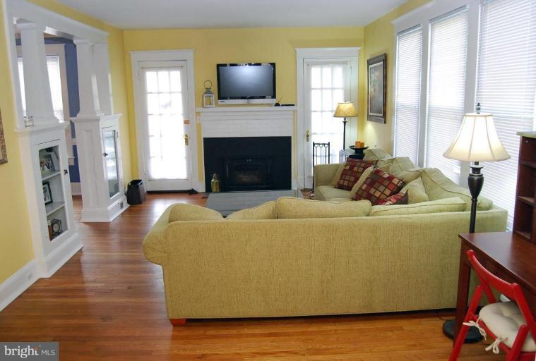 26621 Ridge Road Damascus, MD 20872 - Photo 11 of 18 a living room with furniture and a fireplace