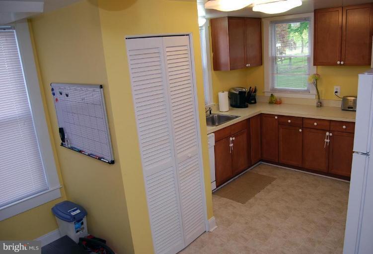 26621 Ridge Road Damascus, MD 20872 - Photo 13 of 18 a kitchen with a sink and a toilet