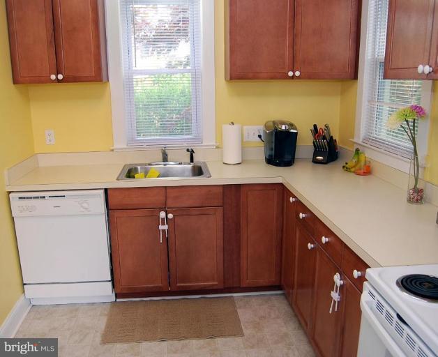 26621 Ridge Road Damascus, MD 20872 - Photo 14 of 18 a kitchen with a sink cabinets and window