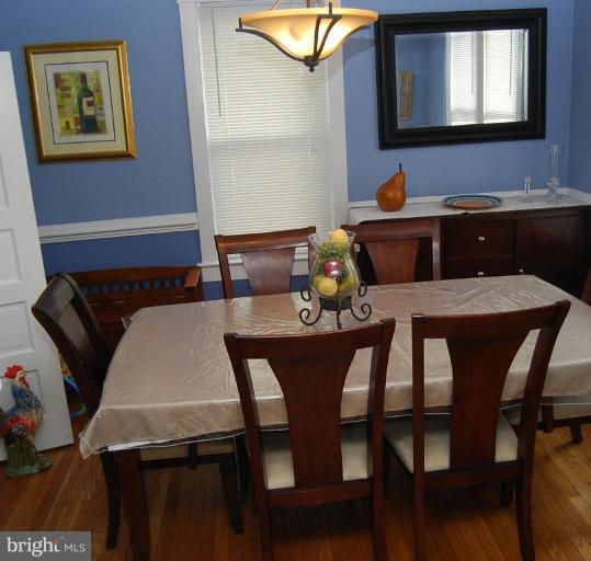 26621 Ridge Road Damascus, MD 20872 - Photo 18 of 18 a view of a dining room with furniture and wooden floor