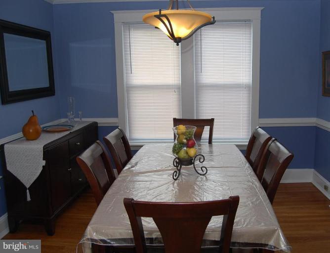26621 Ridge Road Damascus, MD 20872 - Photo 8 of 18 a view of a dining room with furniture and wooden floor