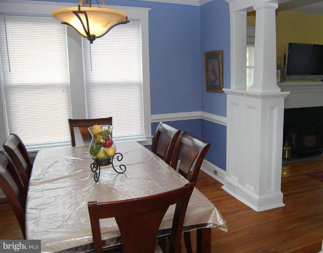 26621 Ridge Road Damascus, MD 20872 - Photo 9 of 18 a view of a dining room with furniture and a flat screen tv