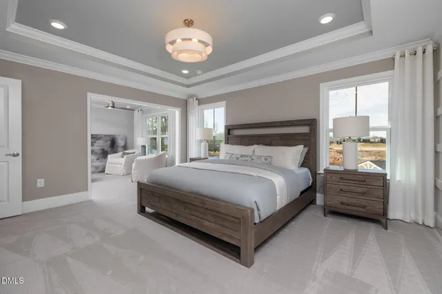 a bedroom with a large bed and a large window