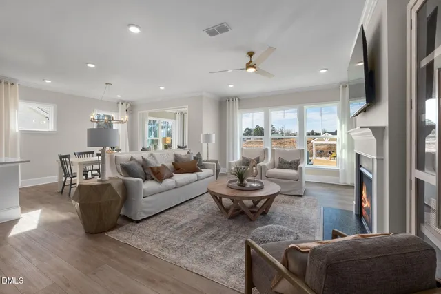 a living room with furniture and a fireplace
