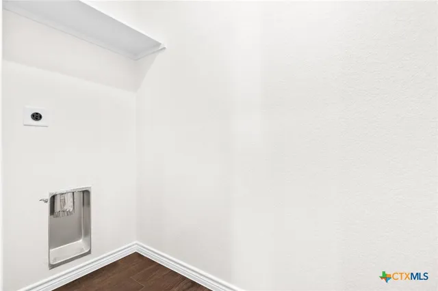 a view of a small space with wooden floor