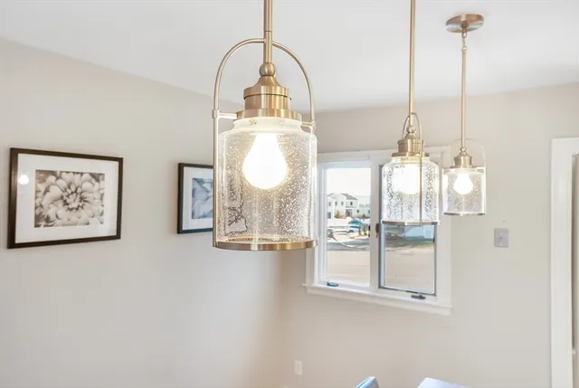 a view of a living room and chandelier