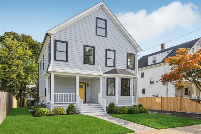 front view of a house with a yard