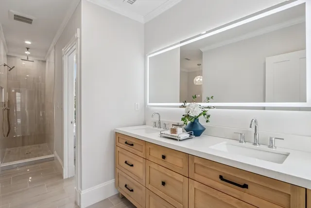 a bathroom with a granite countertop sink mirror and double