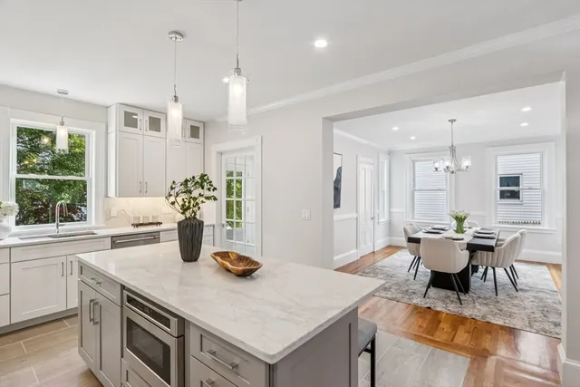 a kitchen with a table and chairs