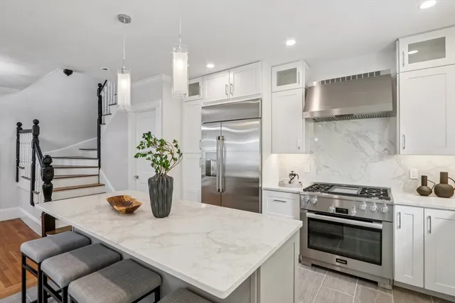a kitchen with a table and chairs