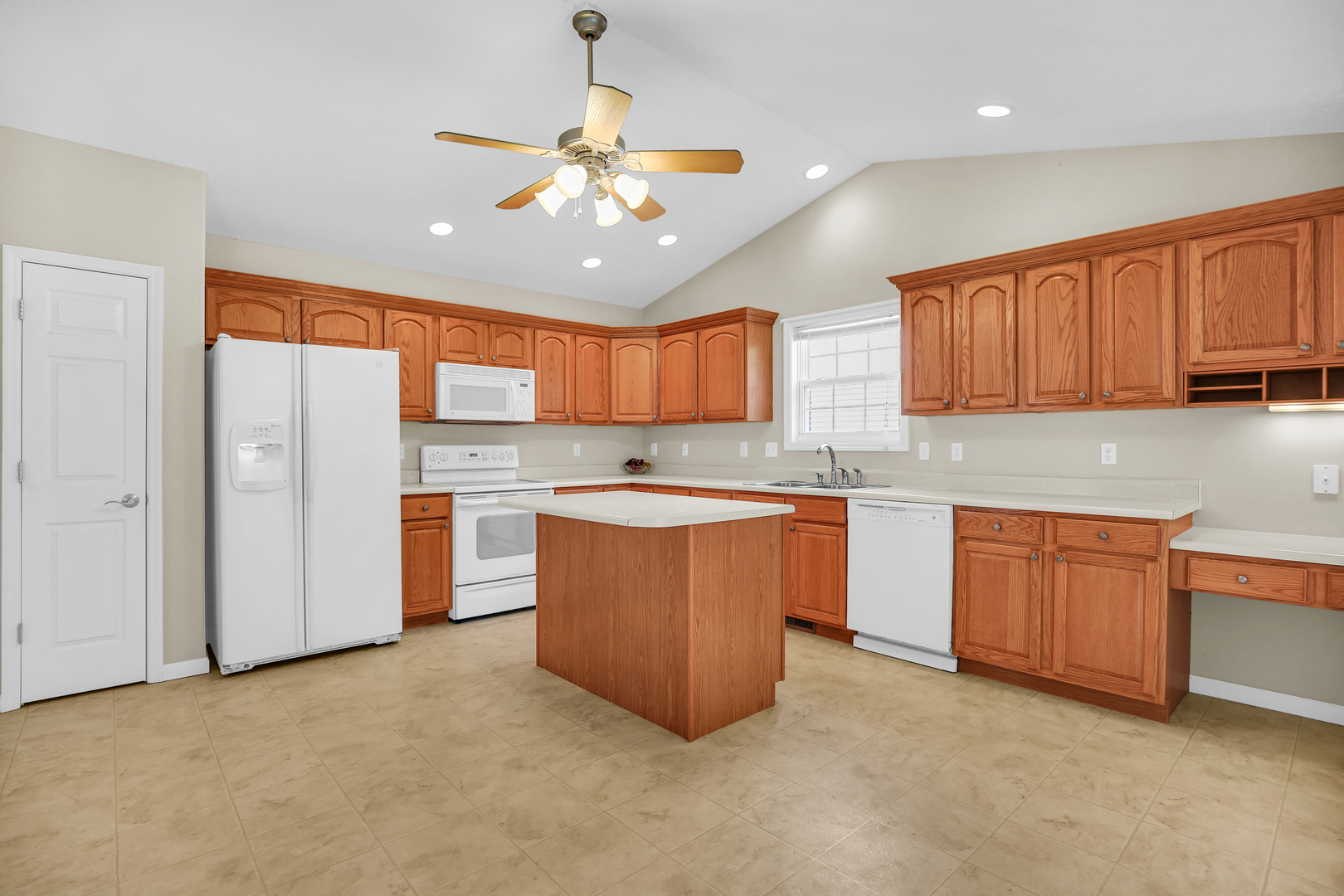 2004 Emerald Drive Champaign, IL 61822 - Photo 11 of 30 a large kitchen with stainless steel appliances granite countertop a stove sink and cabinets