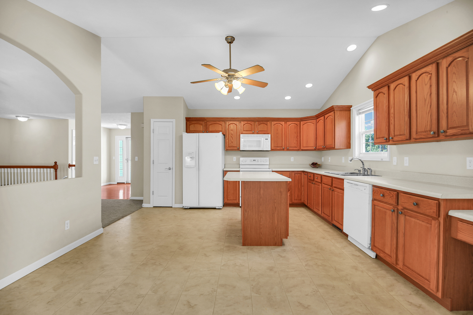 2004 Emerald Drive Champaign, IL 61822 - Photo 12 of 30 a open kitchen with stainless steel appliances granite countertop a refrigerator a sink dishwasher a kitchen island with cabinets and granite countertops