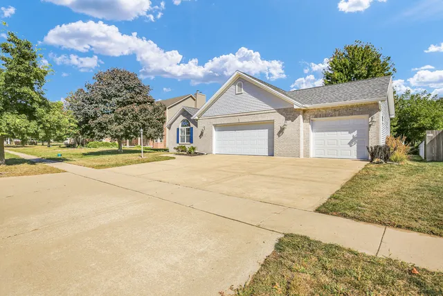 a view of a brick house with many windows