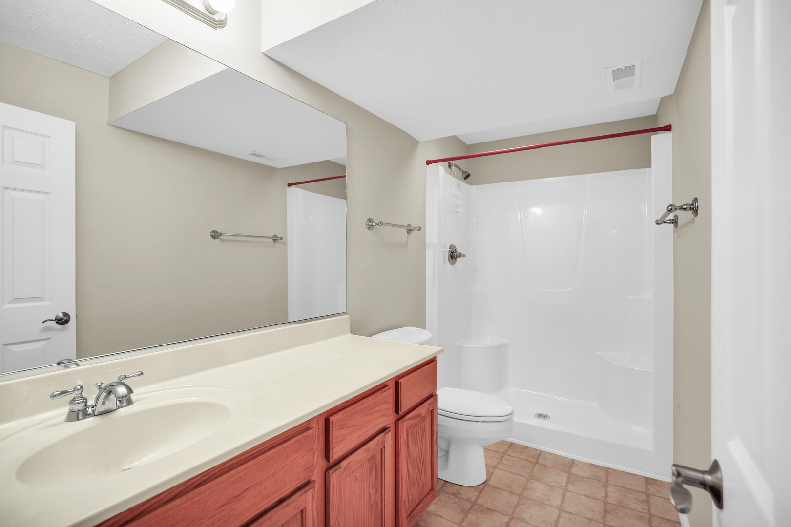 2004 Emerald Drive Champaign, IL 61822 - Photo 25 of 30 a bathroom with a sink a toilet and shower