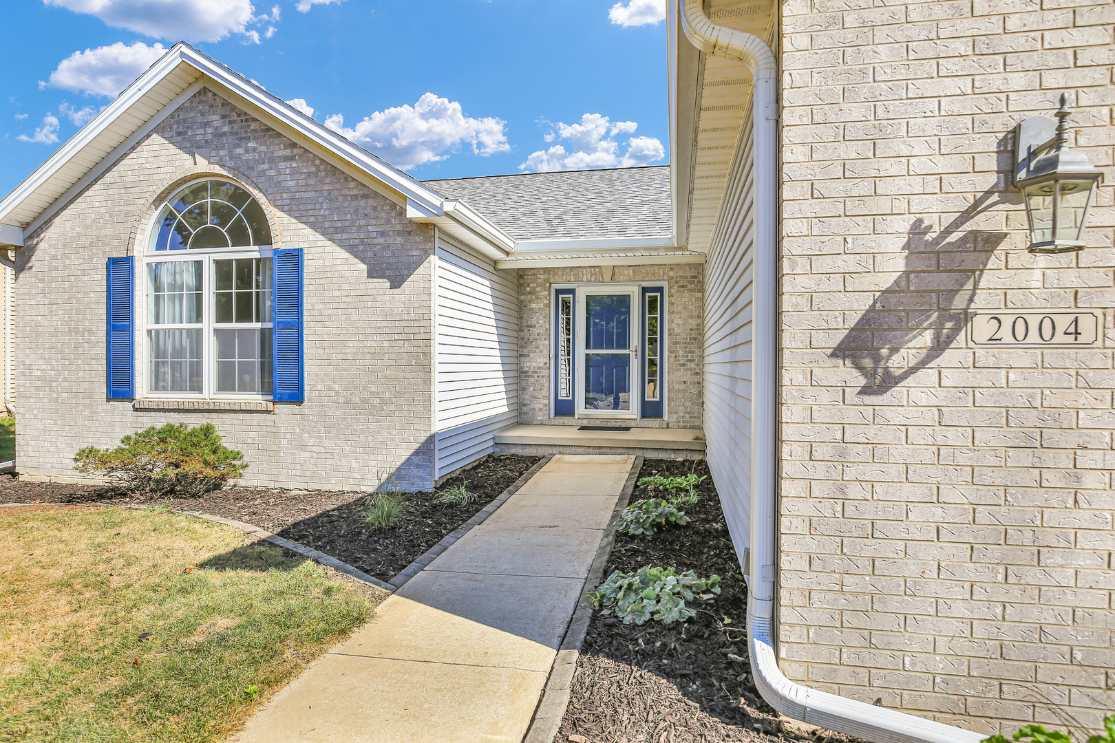 2004 Emerald Drive Champaign, IL 61822 - Photo 3 of 30 a view of a brick house with many windows