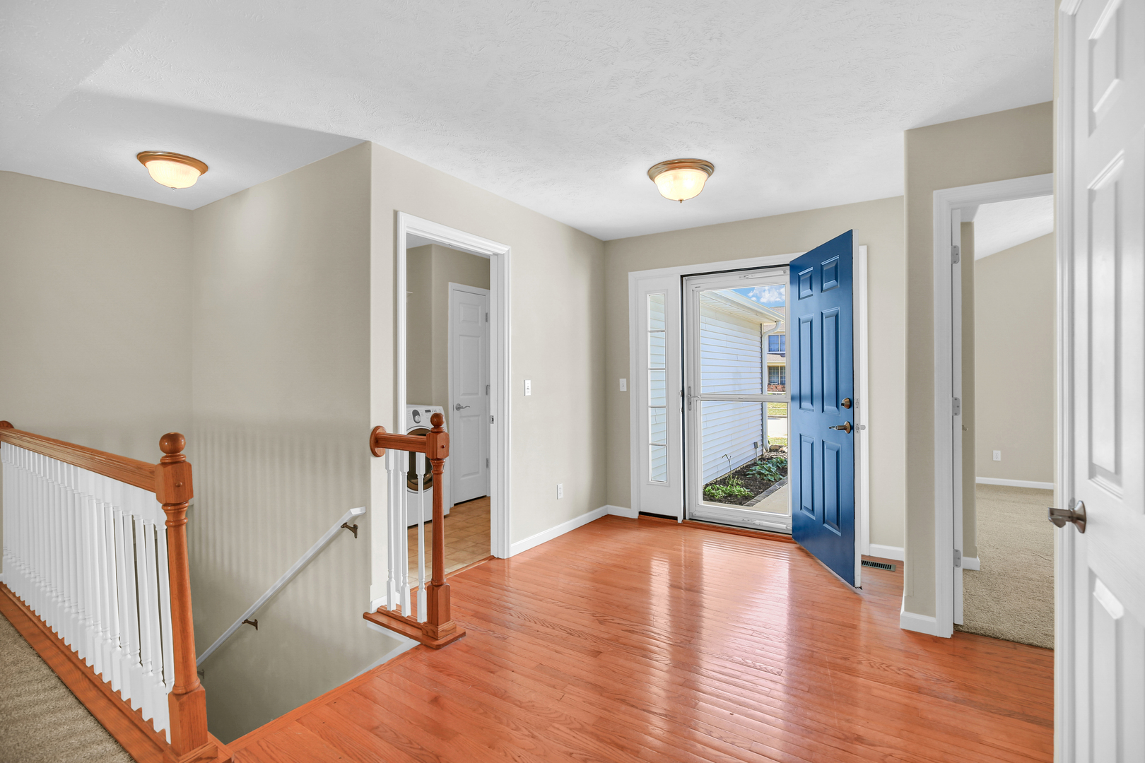 2004 Emerald Drive Champaign, IL 61822 - Photo 6 of 30 a view of a livingroom with wooden floor and stairs