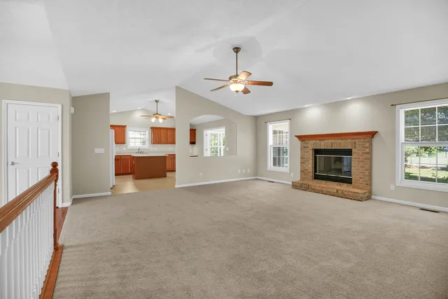an empty room with a kitchen and a sink