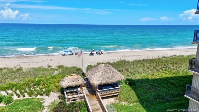 a view of a city street next to a building