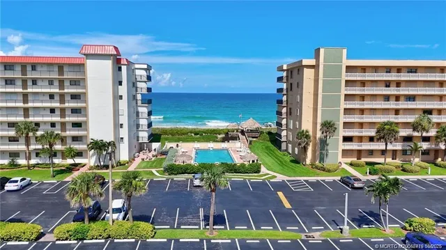 a view of a building with garden and plants