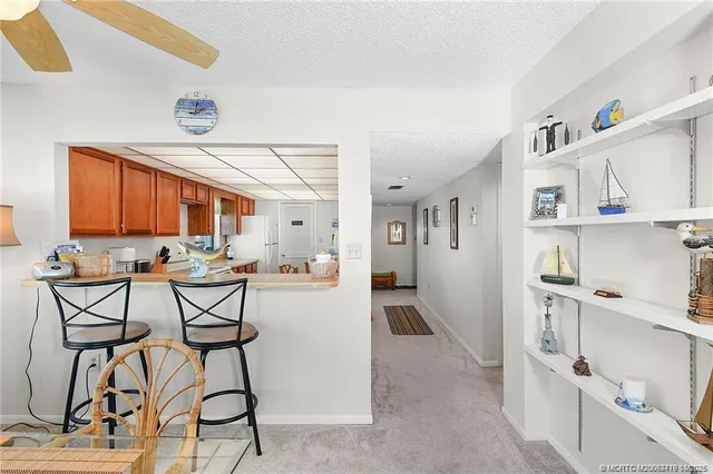 a view of a kitchen and dining room