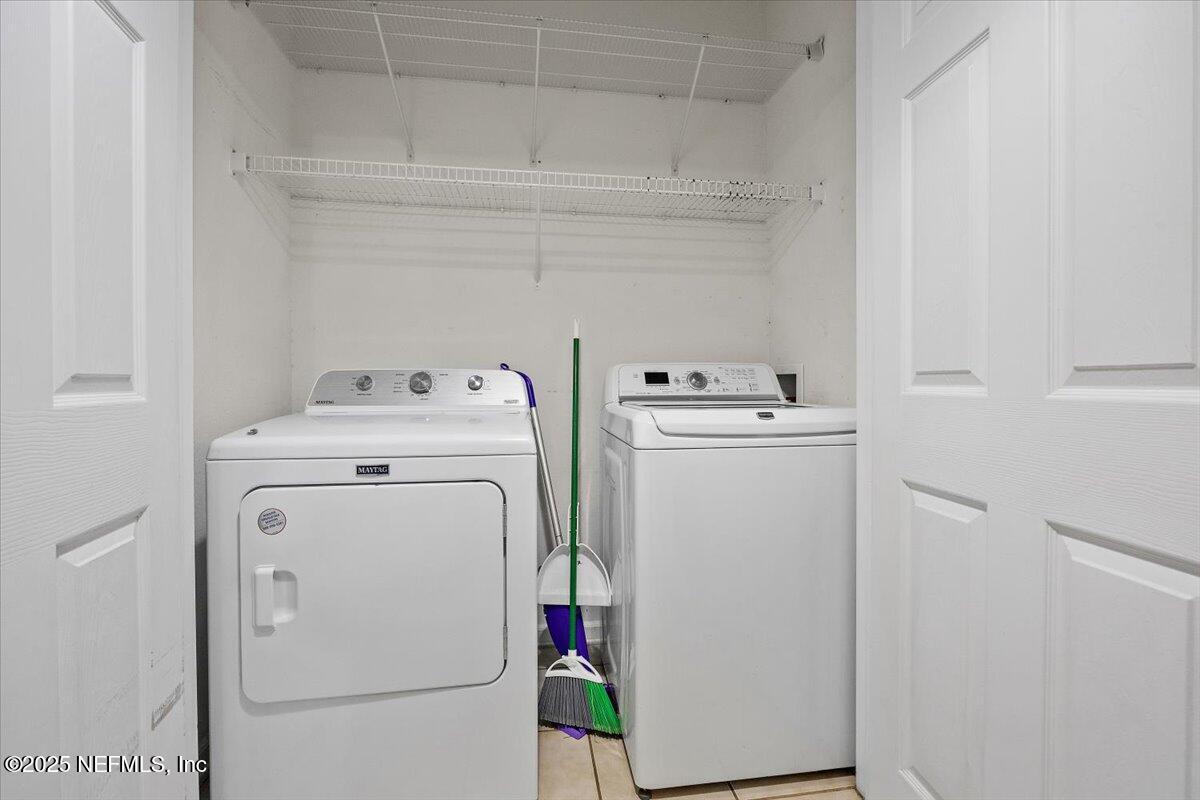 10550 Baymeadows Road, Unit 807 Jacksonville, FL 32256 - Photo 13 of 22 a utility room with dryer and washer