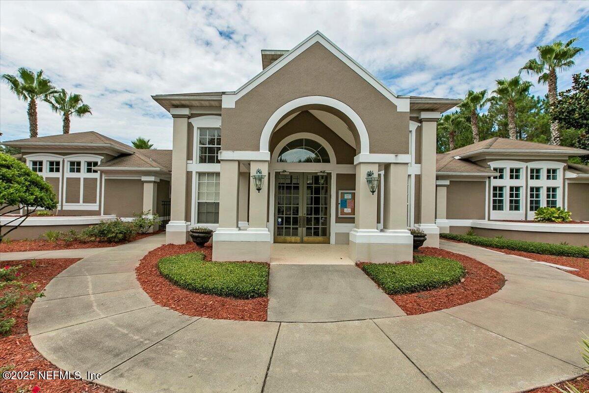10550 Baymeadows Road, Unit 807 Jacksonville, FL 32256 - Photo 14 of 22 a front view of a house with garden