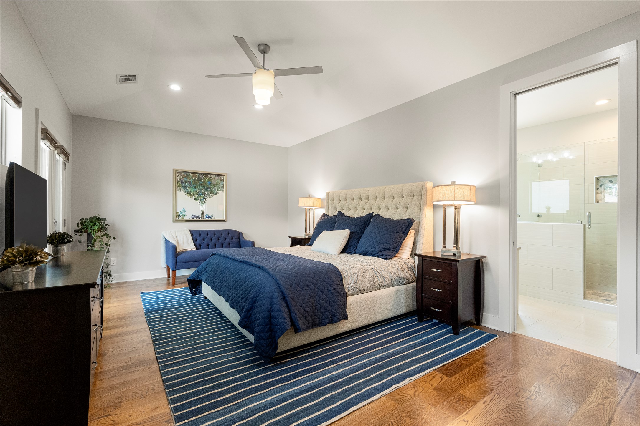 3814 Ridgelea Drive, Unit A Austin, TX 78731 - Photo 19 of 30 a bedroom with a bed and a chandelier