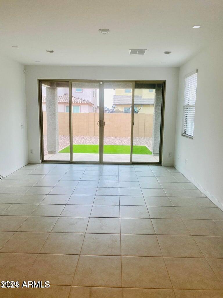 9449 West Roma Avenue Phoenix, AZ 85037 - Photo 15 of 42 a view of an empty room with a window