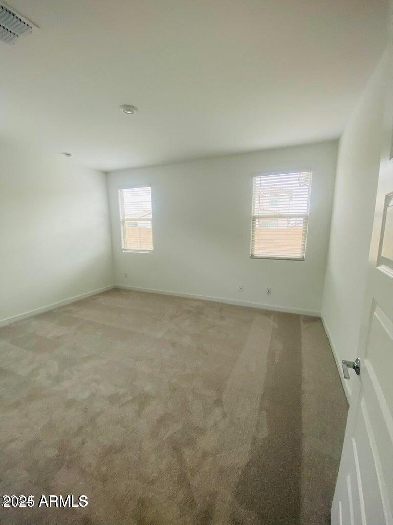 9449 West Roma Avenue Phoenix, AZ 85037 - Photo 20 of 42 an empty room with a window